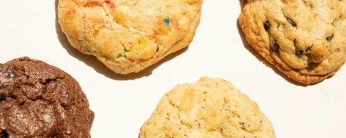 a close up of four cookies on a table